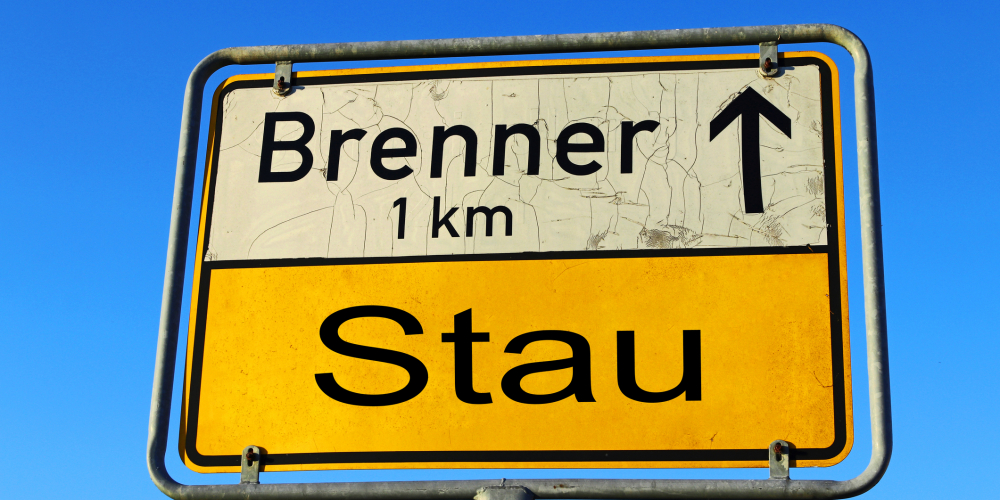 Sign with traffic jam at Brenner Austria Italy