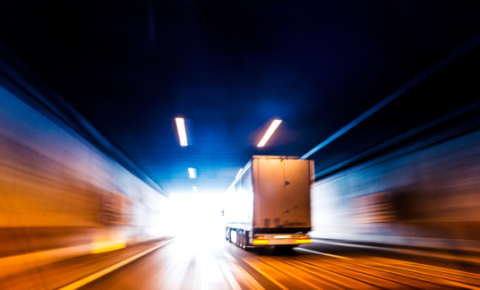 Transports Truck Driving in Tunnel