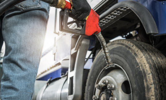 Semi Truck Driver About to Refuel His Tractor Truck with Diesel Fuel