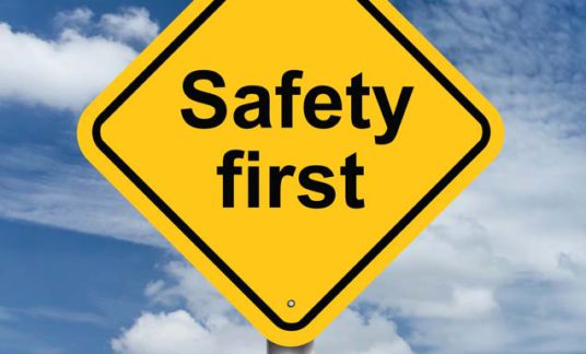 safety first sign banner and clouds blue sky background