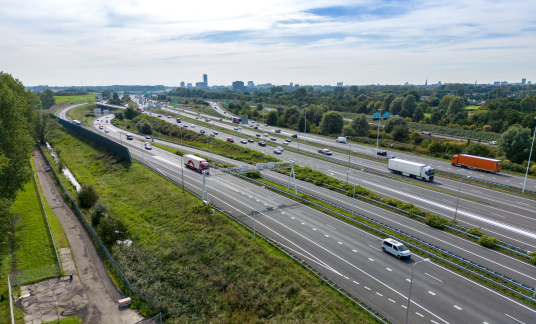 Traffic on highway with cars.