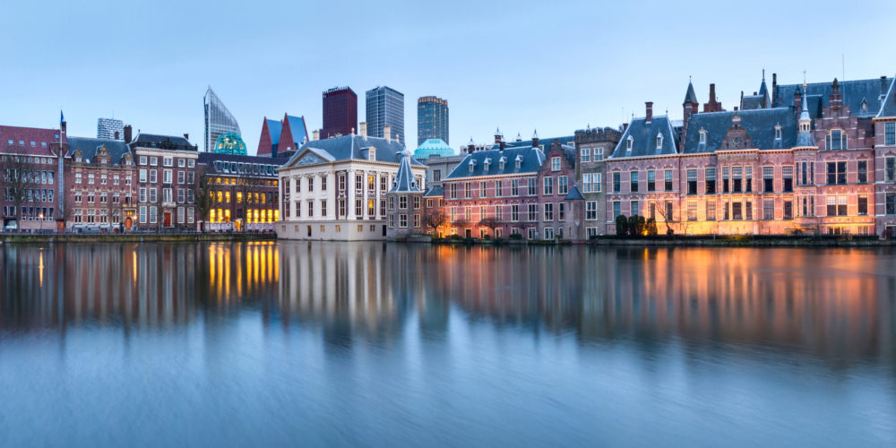 City Landscape, sunset panorama – view on pond Hofvijver and complex of buildings Binnenhof in from the city centre of The Hague