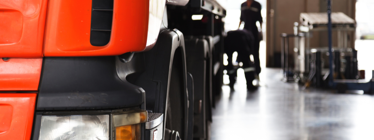 automobile mechanic checking truck in the garage, selective focus