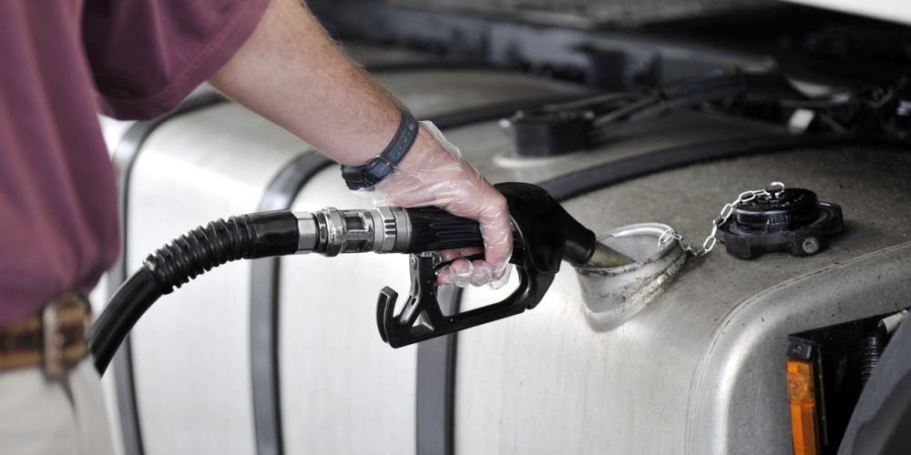 Man filling up the gas tank with gasoline