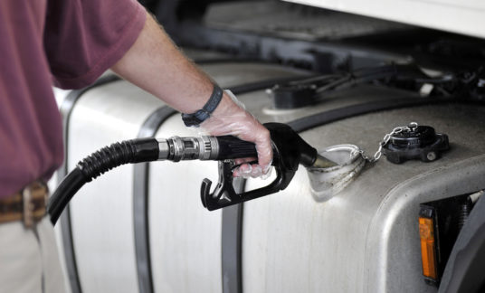 Man filling up the gas tank with gasoline