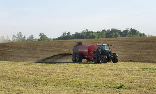 Farmer Spreading Liquid Manure