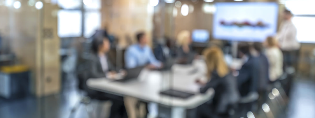 Soft focus business people sitting in conference room