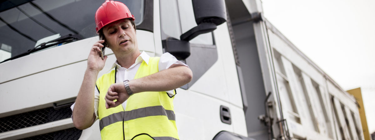 Truck driver talking on mobile phone