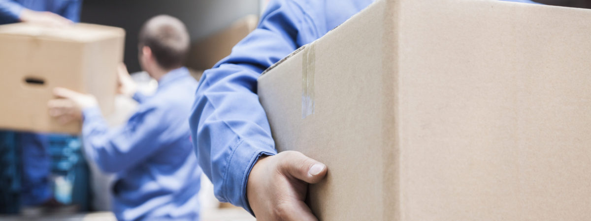 Movers unloading a moving van